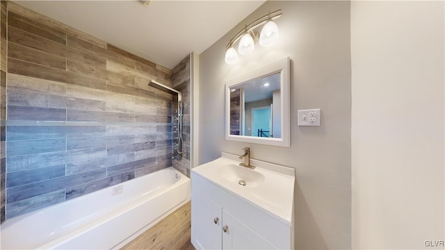 bathroom featuring vanity and tiled shower / bath combo