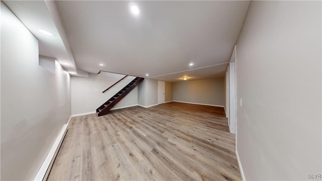 basement featuring light wood-type flooring