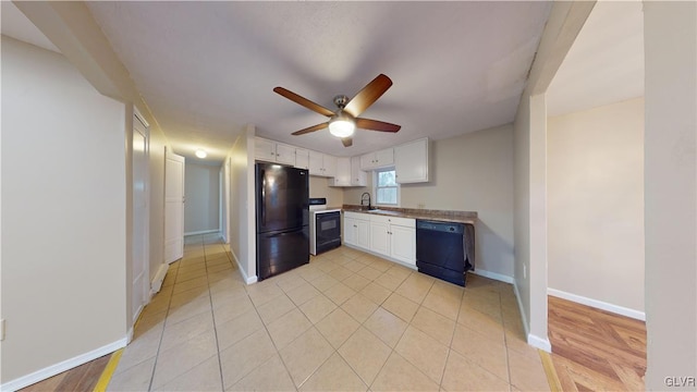 kitchen with ceiling fan, sink, black appliances, light hardwood / wood-style flooring, and white cabinets