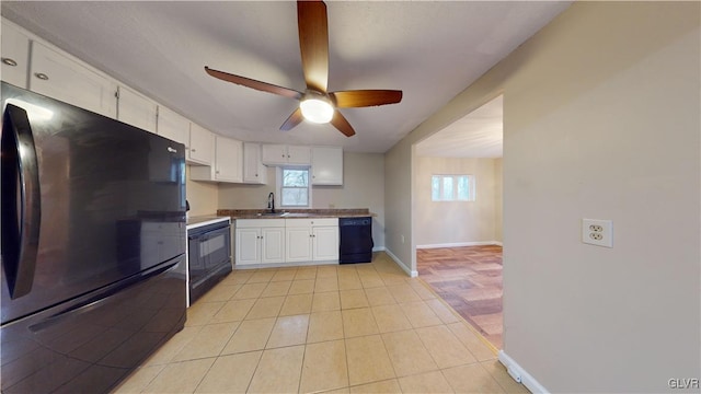 kitchen featuring white cabinets, ceiling fan, plenty of natural light, and black appliances