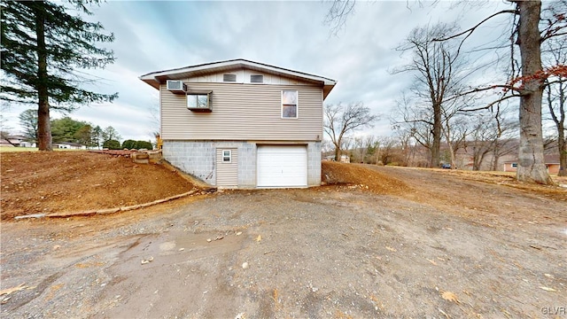 view of side of property featuring a garage