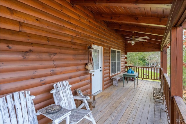 wooden terrace with ceiling fan and a porch