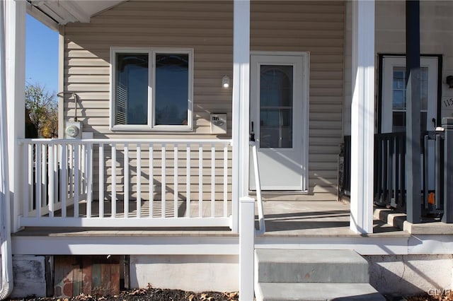 view of exterior entry featuring a porch