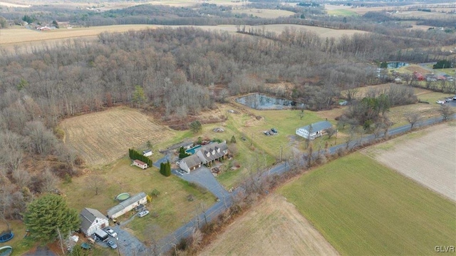 birds eye view of property with a rural view