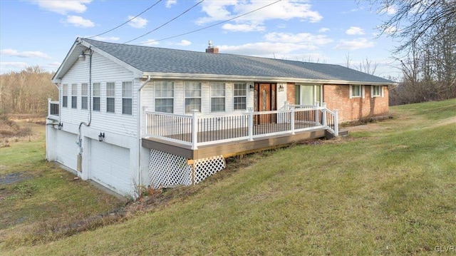 ranch-style home with a garage and a front yard