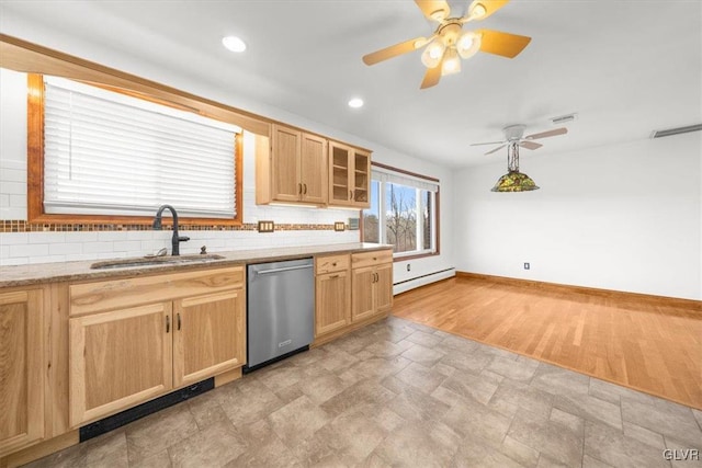 kitchen featuring dishwasher, light wood-type flooring, tasteful backsplash, and sink