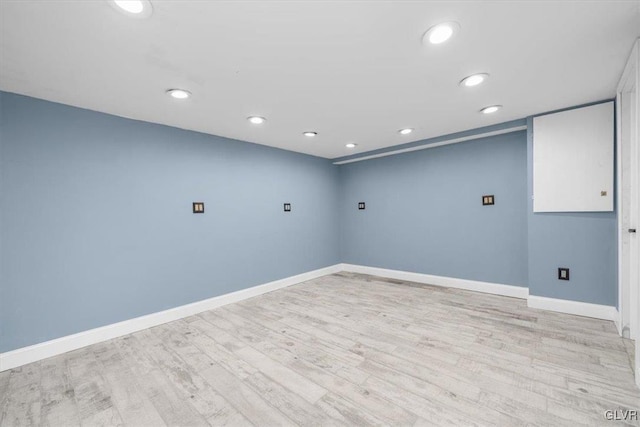 spare room featuring light hardwood / wood-style floors