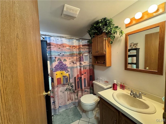 bathroom with toilet, vanity, tile patterned floors, and walk in shower