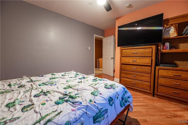 bedroom featuring light hardwood / wood-style flooring and ceiling fan