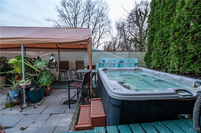 deck with a bar and a hot tub