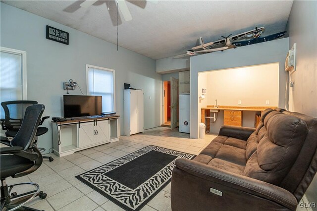 tiled living room featuring ceiling fan