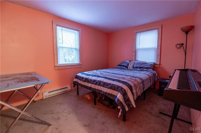 bedroom featuring baseboard heating and carpet