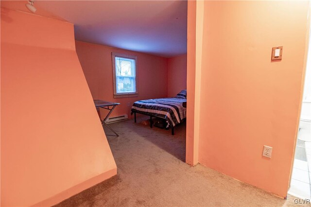 bedroom featuring carpet floors and a baseboard heating unit