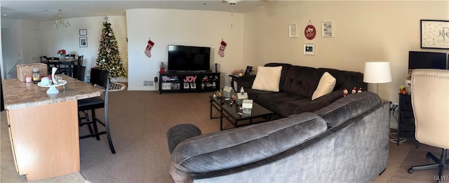 carpeted living room featuring ceiling fan