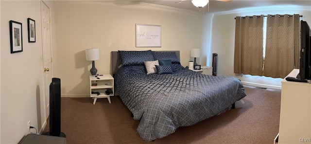 carpeted bedroom featuring ceiling fan and crown molding