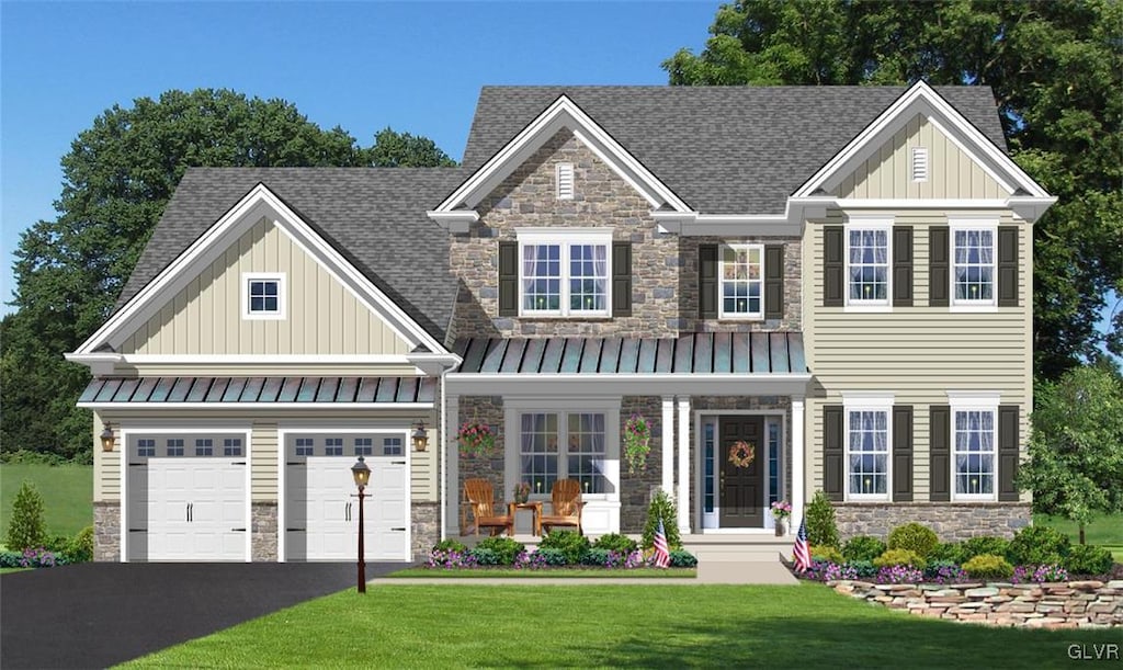 craftsman inspired home with a garage and a front yard