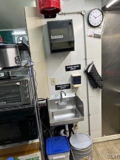 utility room featuring sink