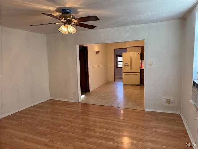 unfurnished room featuring light hardwood / wood-style flooring and ceiling fan