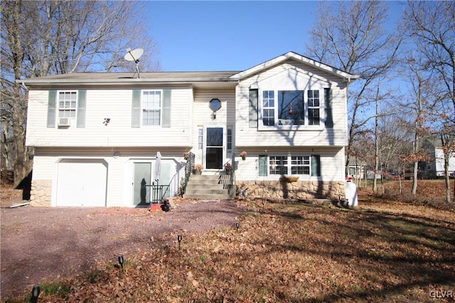 split foyer home featuring a garage