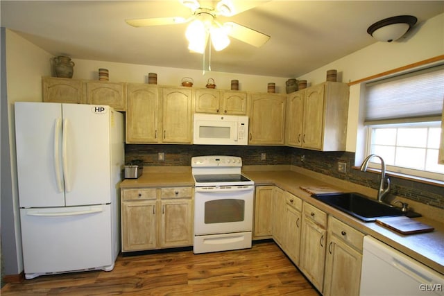 kitchen with light brown cabinets, white appliances, dark wood-type flooring, sink, and tasteful backsplash