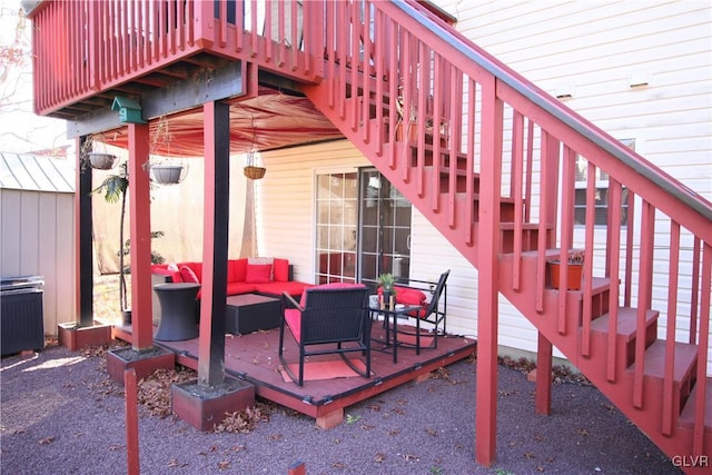 view of patio featuring an outdoor hangout area and a wooden deck