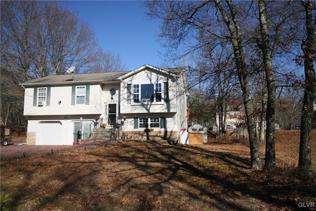 raised ranch featuring a garage