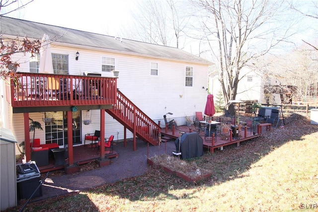 rear view of house featuring a deck