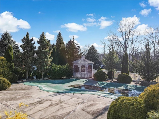 view of swimming pool featuring a gazebo and a patio area