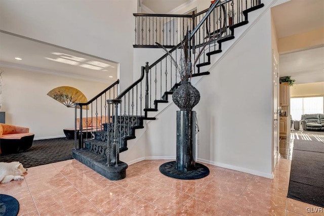 staircase featuring ornamental molding