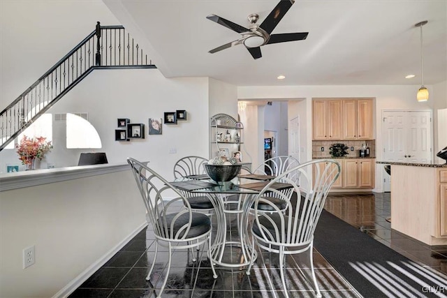 tiled dining room with ceiling fan