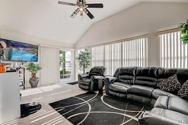 living room with carpet flooring, vaulted ceiling, and ceiling fan