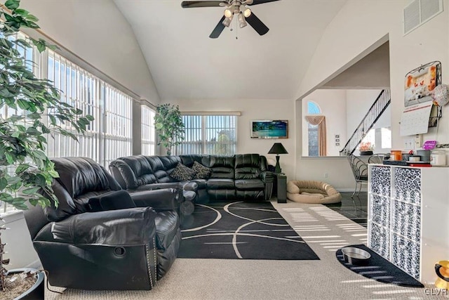 living room featuring carpet, vaulted ceiling, a wealth of natural light, and ceiling fan