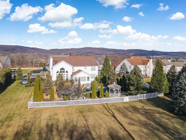 drone / aerial view featuring a mountain view