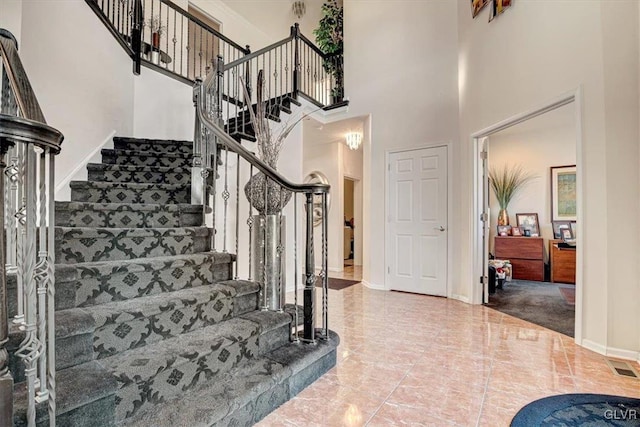 foyer entrance with a high ceiling