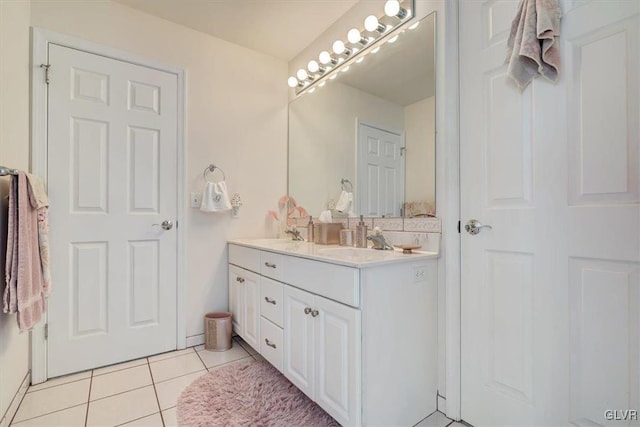 bathroom featuring tile patterned flooring and vanity