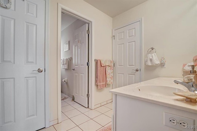 bathroom with tile patterned floors and vanity