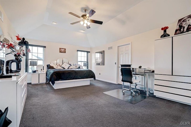 bedroom with dark colored carpet, ceiling fan, and vaulted ceiling