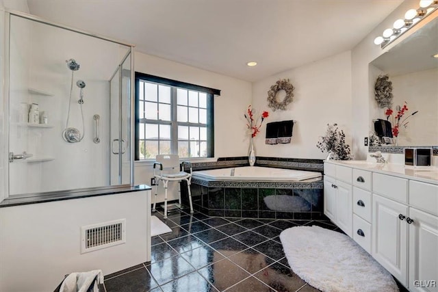 bathroom featuring tile patterned flooring, vanity, and independent shower and bath