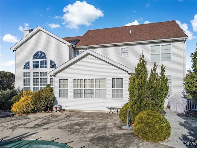 back of property with a patio area