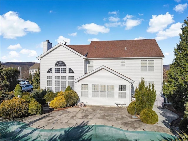 rear view of property featuring a patio