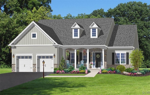 view of front facade with covered porch, a garage, and a front lawn