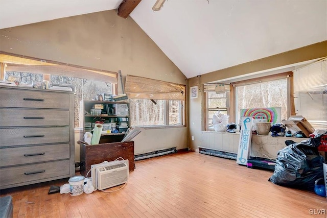 miscellaneous room with lofted ceiling with beams and light hardwood / wood-style floors