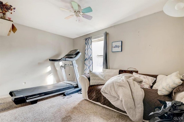 workout area featuring carpet floors and ceiling fan