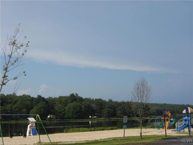 view of jungle gym featuring a water view