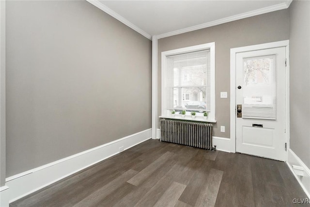 interior space featuring crown molding, radiator heating unit, and dark hardwood / wood-style floors