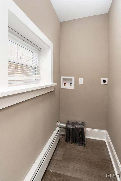 laundry area featuring electric dryer hookup, dark hardwood / wood-style flooring, baseboard heating, and hookup for a washing machine