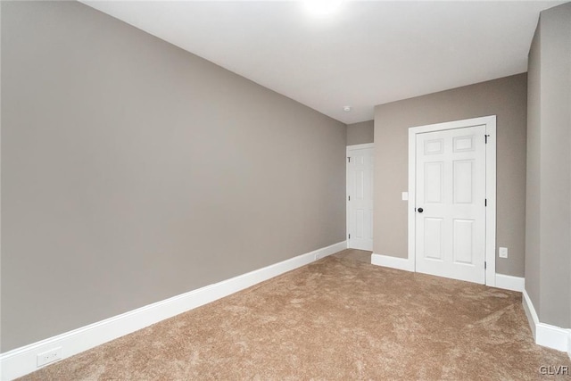 unfurnished bedroom with a closet and carpet floors