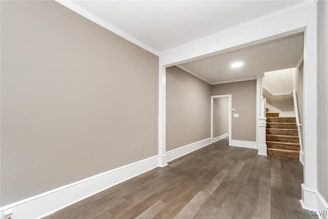 basement with dark hardwood / wood-style flooring and ornamental molding