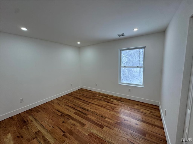 unfurnished room featuring hardwood / wood-style floors