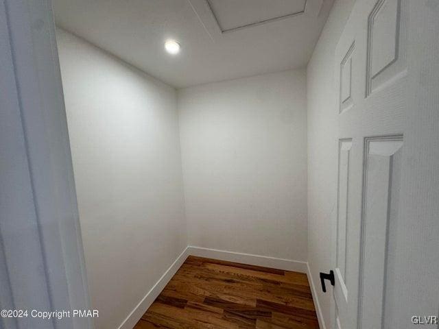 unfurnished room with dark hardwood / wood-style floors